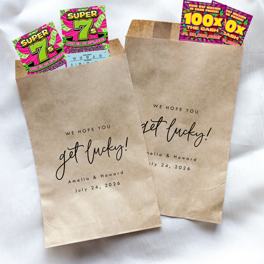 Two brown paper bags with personalized text and lottery tickets on a white background