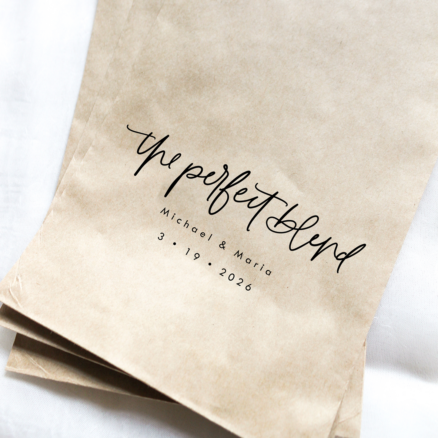 Kraft paper bags with 'the perfect blend' text on a white background