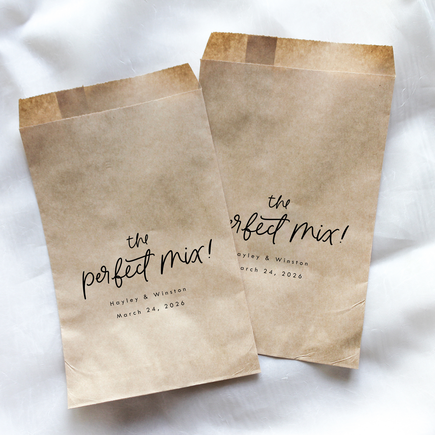 Two brown paper bags with 'the perfect mix!' text on a white background