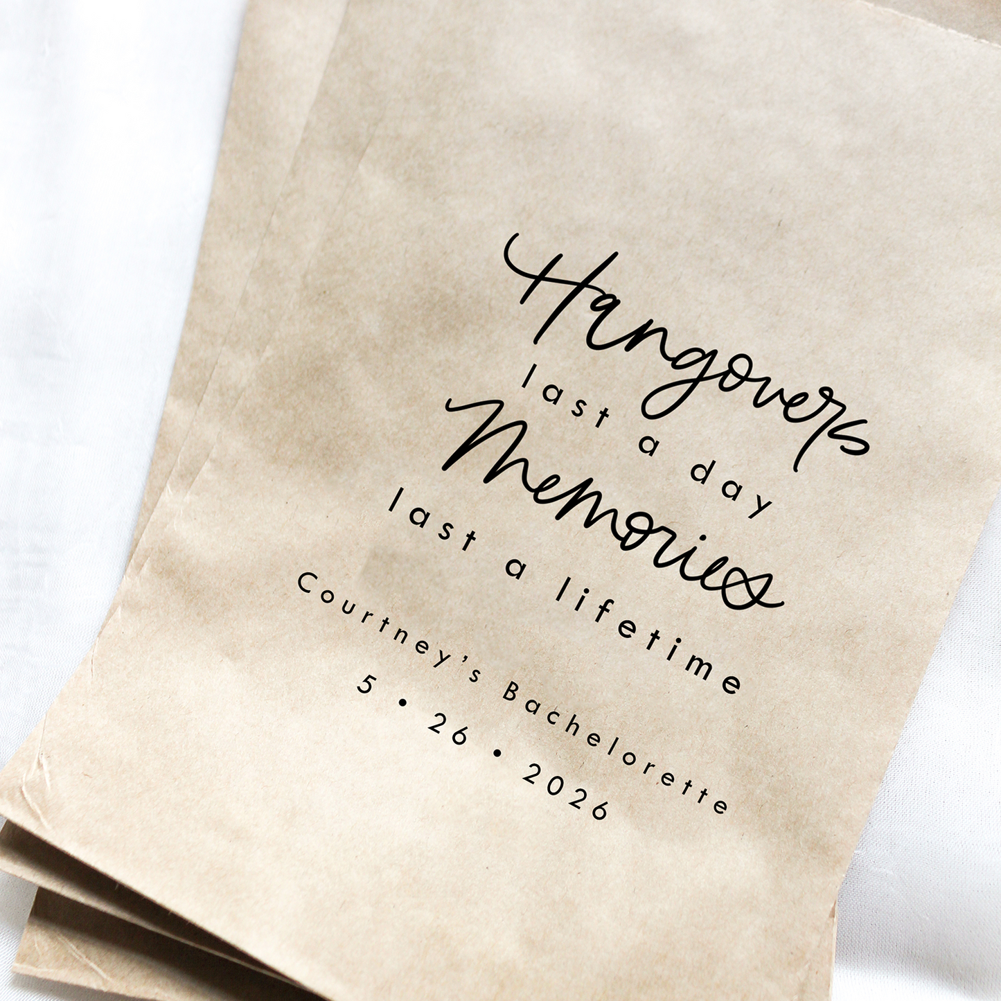 Kraft paper bags with personalized text on a white background