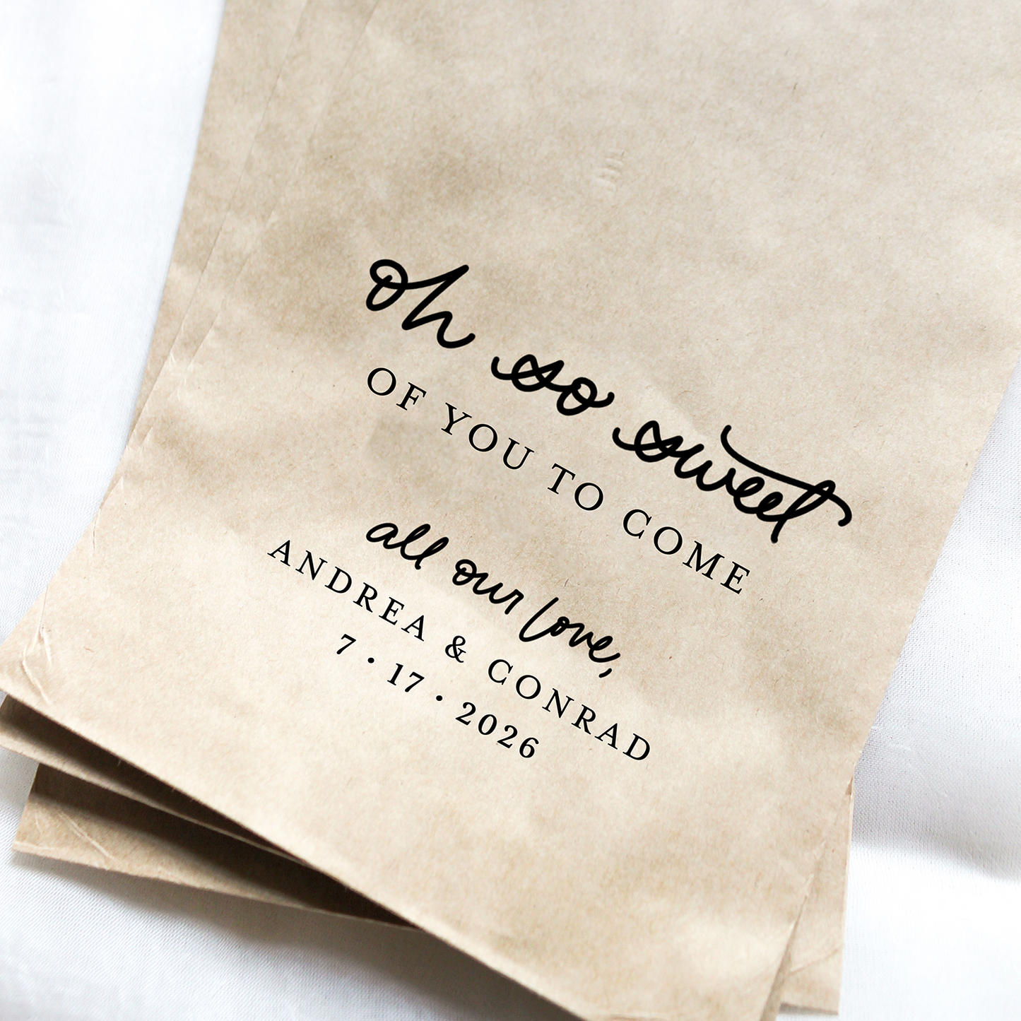 Kraft paper bags with personalized text on a white background
