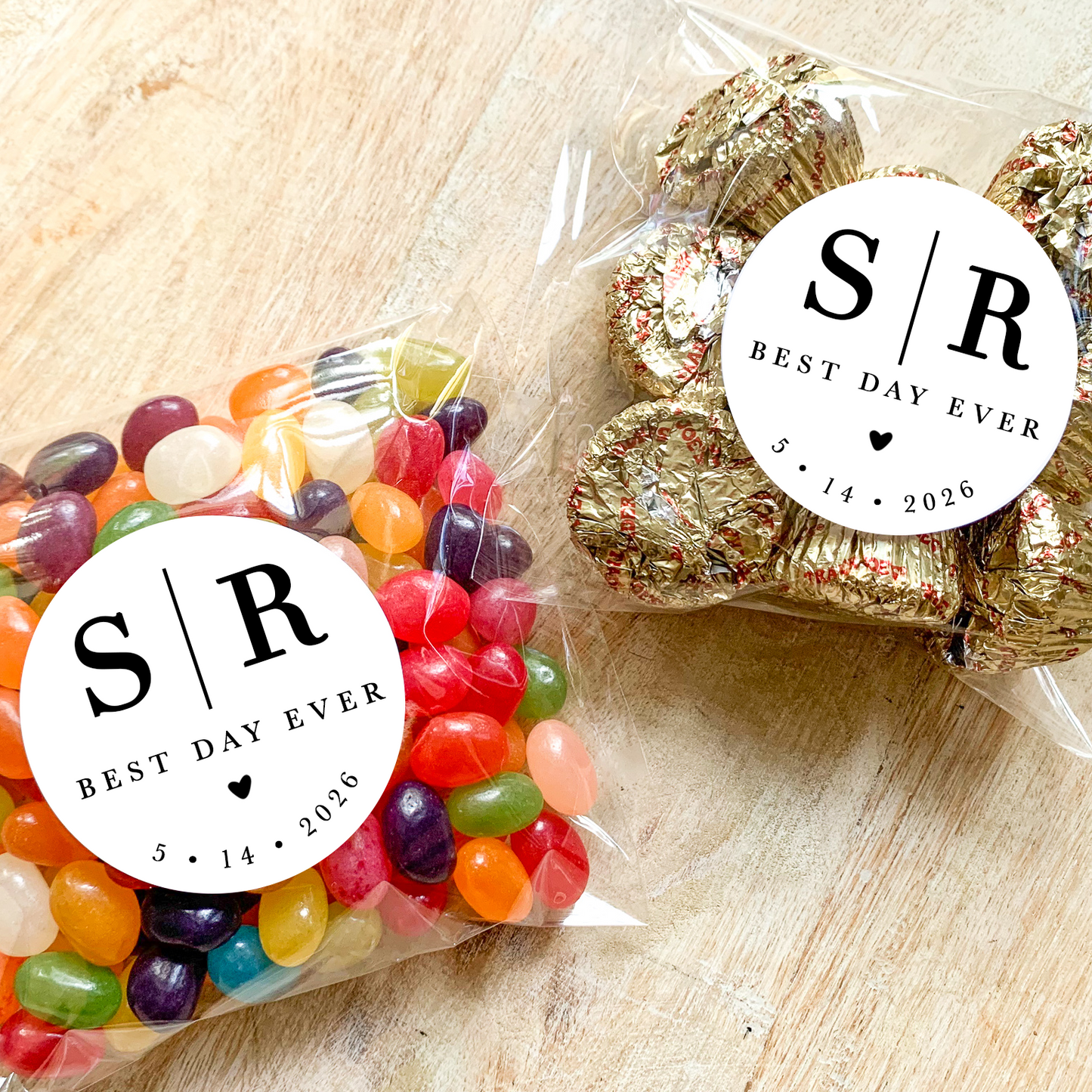 Two packages of candy with 'S/R Best Day Ever' labels on a wooden surface