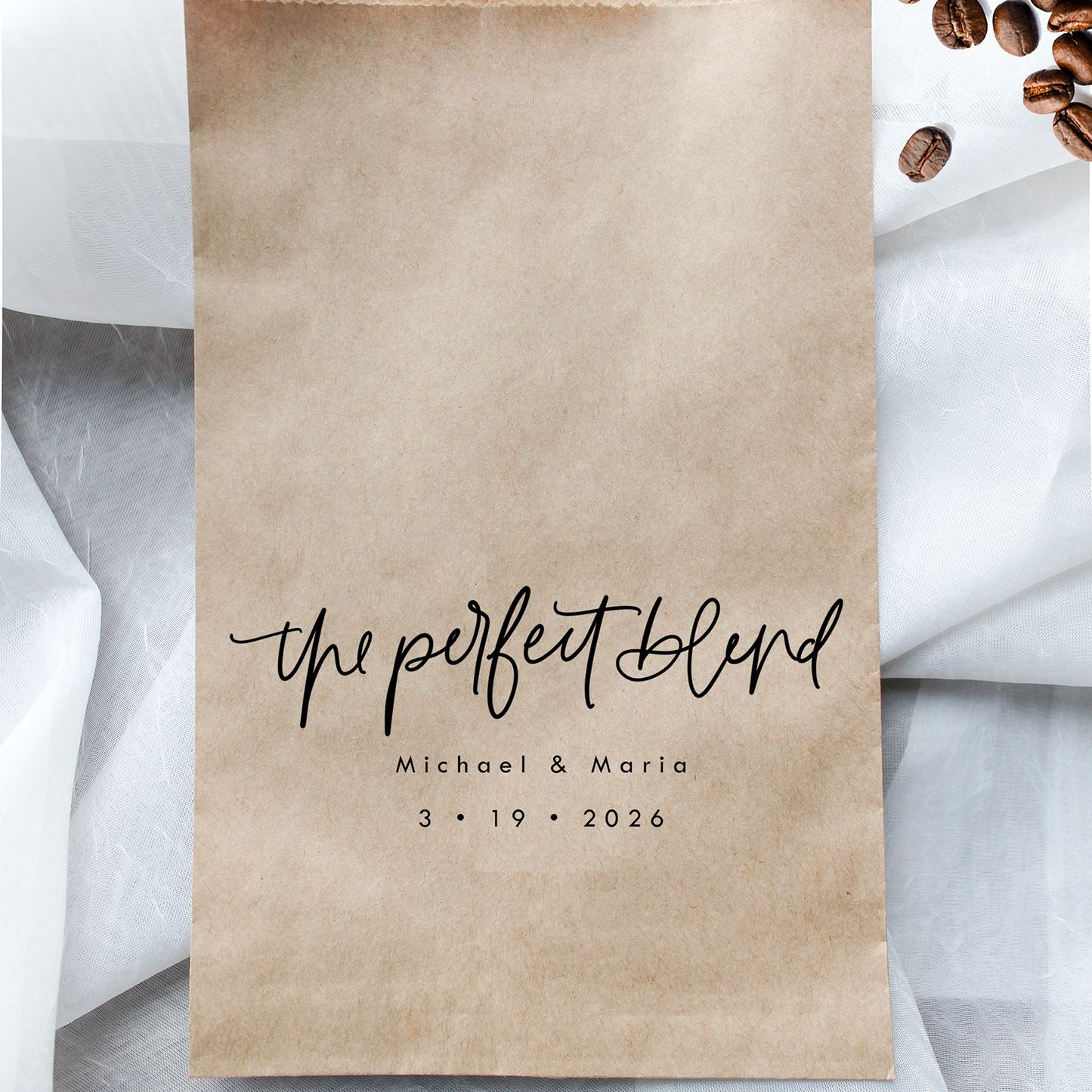 Kraft paper bag with 'the perfect blend' text and coffee beans on a light background