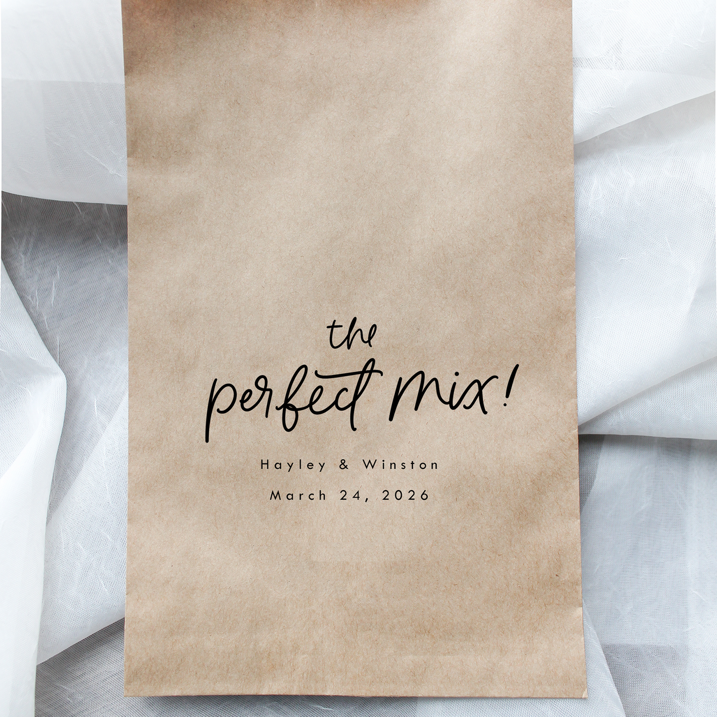 Brown paper bag with 'the perfect mix!' text on a light gray background