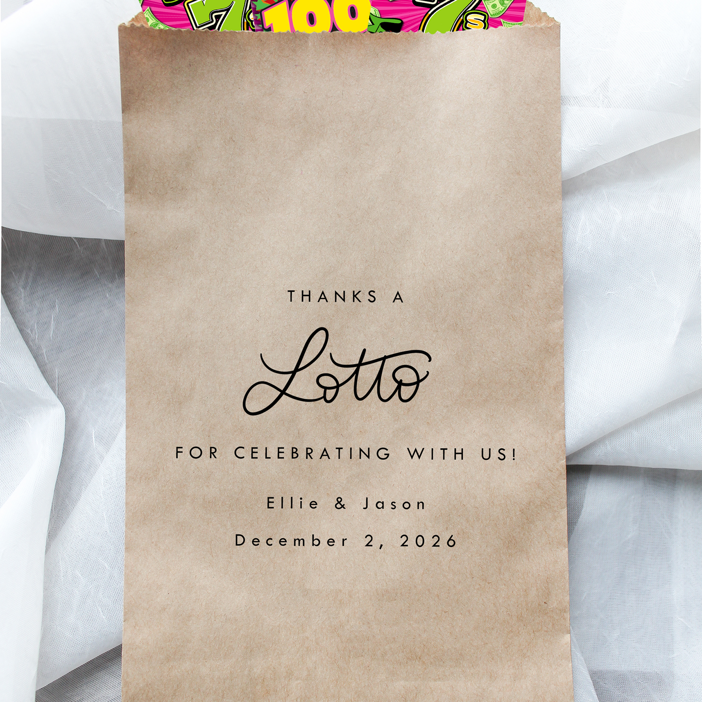 Kraft paper bag with 'Thanks a Lotto' text and lottery tickets on a white fabric background