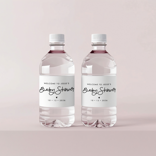 Two water bottles with baby shower labels on a light pink background