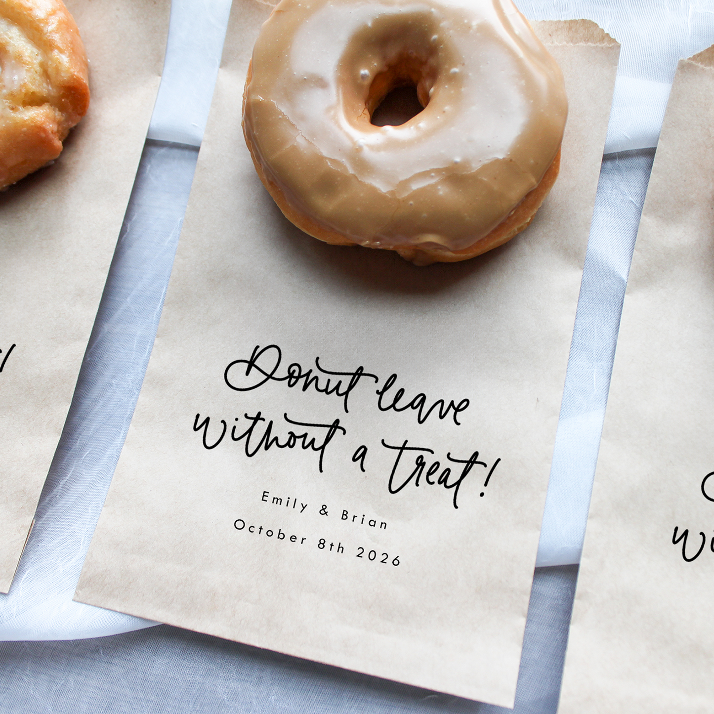 Donuts on brown paper bags with personalized text on a light gray background