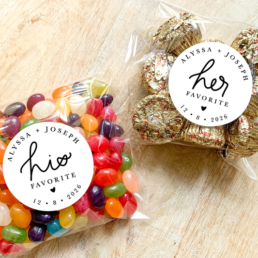 Two packages of candy with personalized labels on a wooden surface