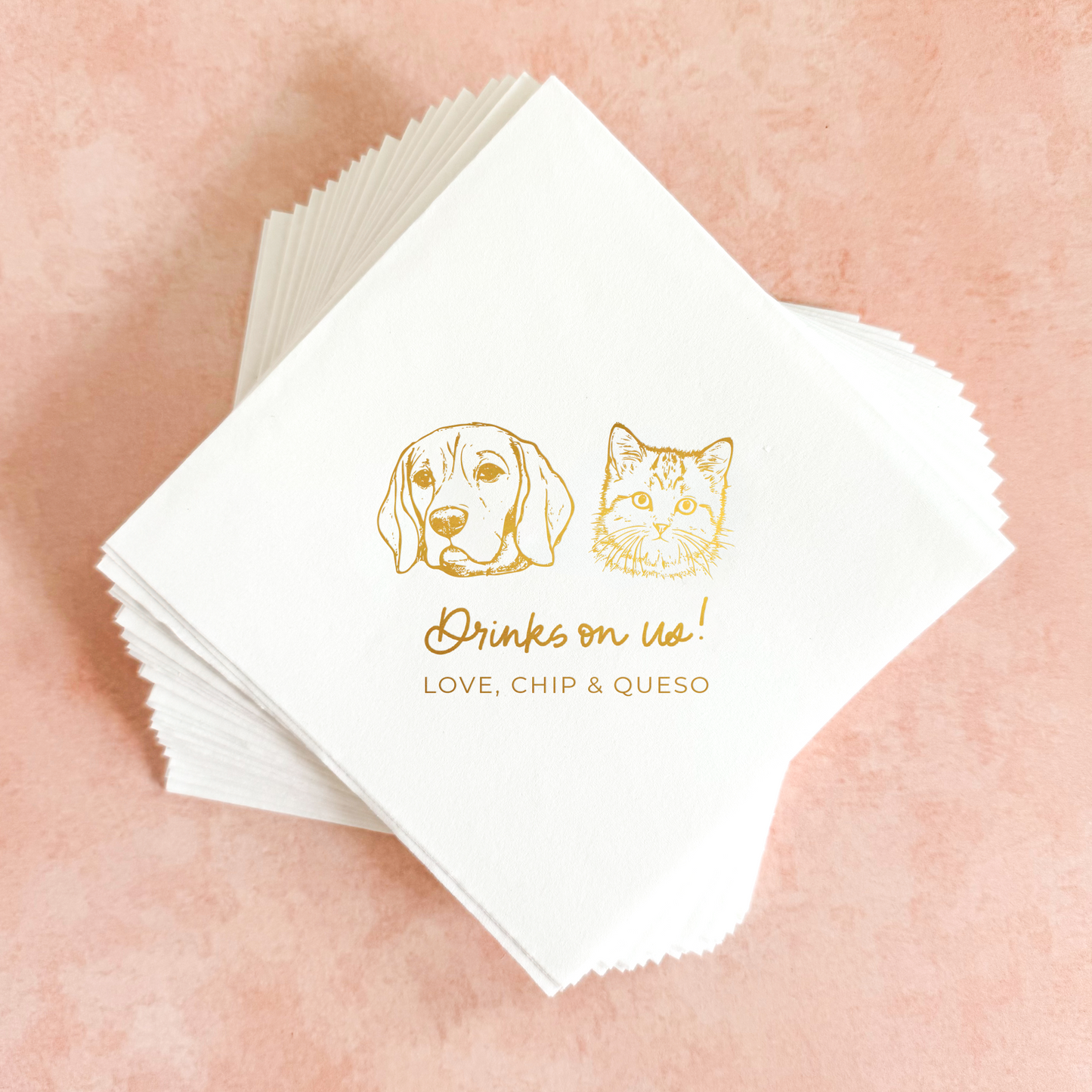Stack of white napkins with gold dog and cat illustration and text on a pink background