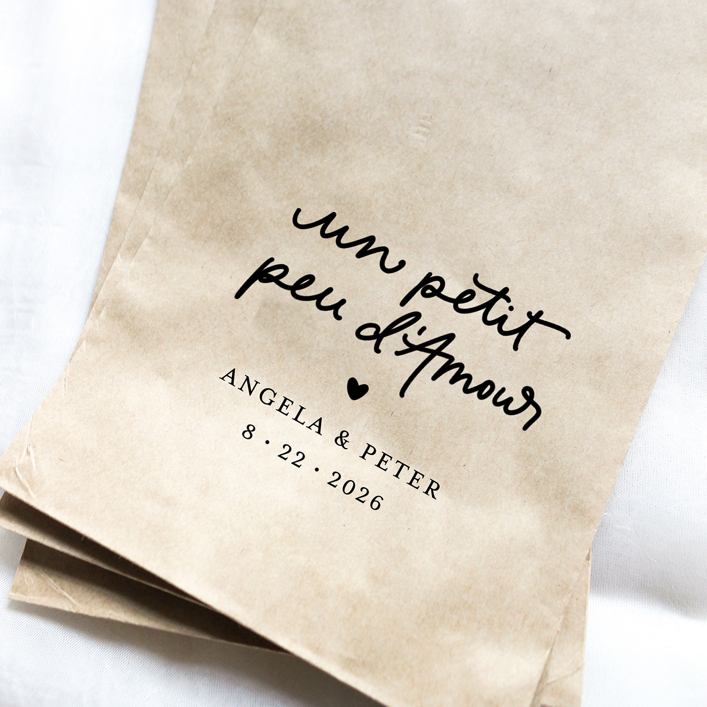 Two brown paper bags with personalized text on a white background